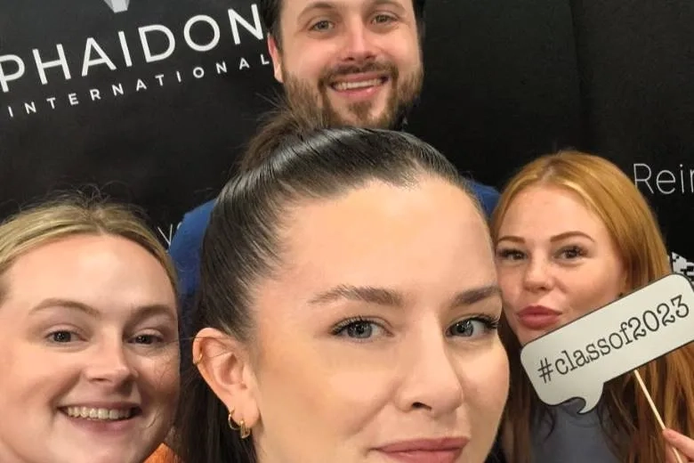 4 people taking selfie